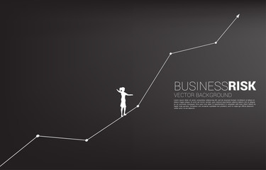 Silhouette of businesswoman walking on rope walk way up to growth line graph.Concept for business risk and career path