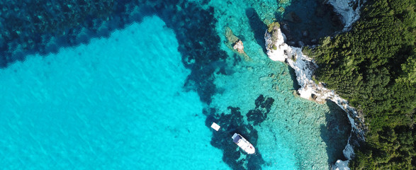 Aerial drone ultra wide photo of paradise tropical exotic white rocky deep turquoise seascape forming a blue lagoon in Caribbean popular destination