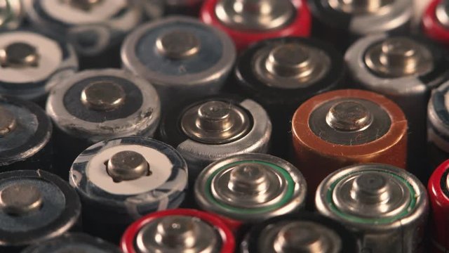 Rotating used batteries. Disposal of batteries. Battery recycling. Waste sorting