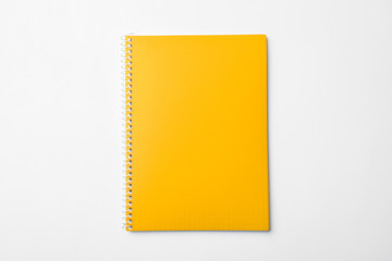 Stylish yellow notebook isolated on white, top view