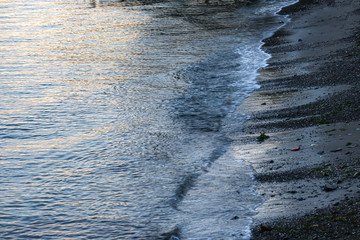 shoreline on bainbridge island with glow from the setting sun