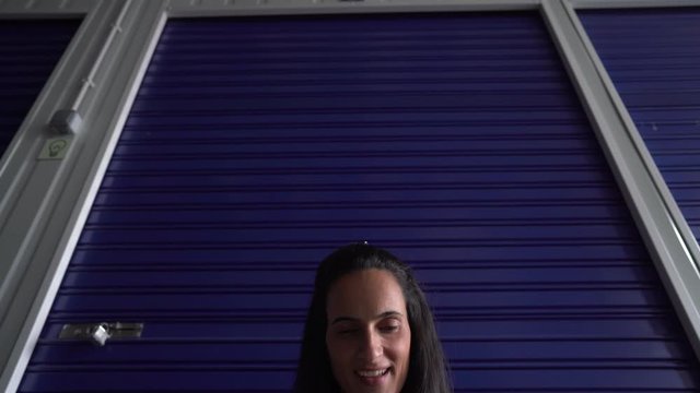 Woman sitting at self storage floor 
