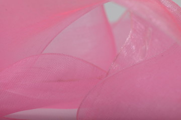 Pink satin ribbon texture for background / wallpaper