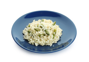 Delicious risotto with asparagus isolated on white