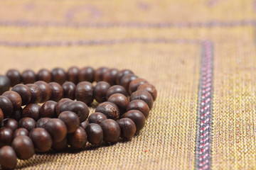 Close up shoot of a Praying beads on a sajadah (Carpet for moslem praying)