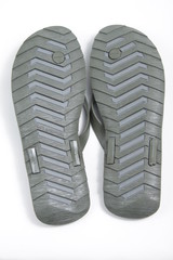 A pair of brown coffee sandals on a white isolated background