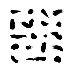 Obraz na płótnie Canvas Grunge hand drawn black stains vector design elements set. Dry brush strokes spots, blobs collection isolated on white background.