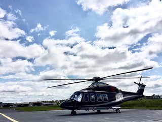 Fototapeta na wymiar Large executive helicopter parked in airport waiting for businessman in sunny day