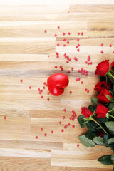 Obraz na płótnie Canvas Flowers composition. Frame made of rose flowers, confetti. Valentine's Day background.