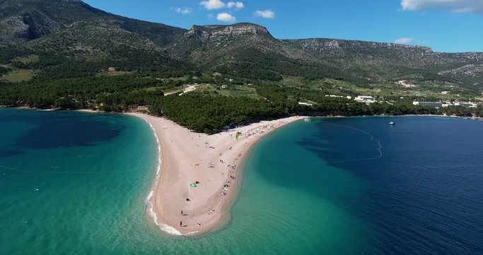 Aerial Drone Shot of Brac Island Craotia, Zlatni Rat Golden Cape During Summer with People on the Beach and Kite Boarding and Kite Surfers