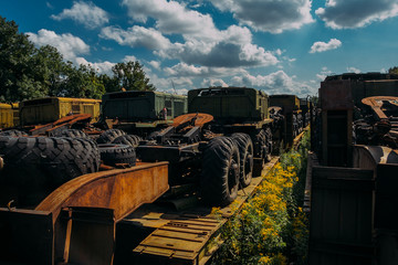 Rusty abandoned Russian military cars for scrap metal