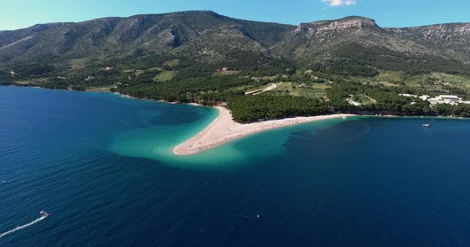 Aerial Drone Shot of Brac Island Craotia, Zlatni Rat Golden Cape During Summer with People on the Beach and Kite Boarding and Kite Surfers