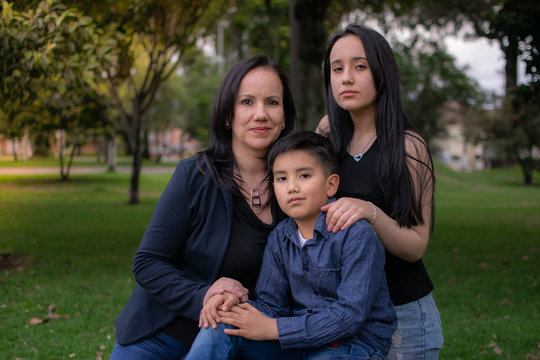 Colombian family mother daughter and son in the park celebrating mothers day