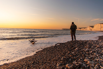 Photographer on Seven Sisters Beach for sunset.