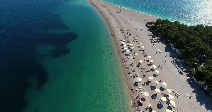 Aerial Drone Shot of Brac Island Craotia, Zlatni Rat Golden Cape During Summer with People on the Beach and Kite Boarding and Kite Surfers
