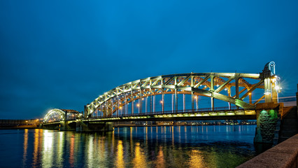 Obraz premium Night view of the Bolsheokhtinsky bridge (Peter the Great bridge) decorated for the Christmas/New Year. Saint-Petersburg, Russia.