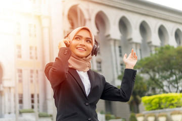 Cute Malay Woman wearing hijab outdoor executive
