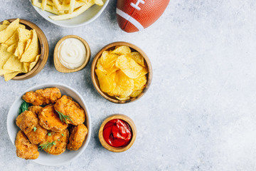 Table fof tasty snacksprepared for watching sports on TV. Top view. Flt lay