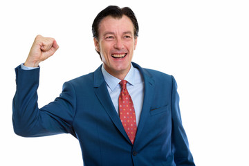 Thoughtful mature happy businessman getting good news