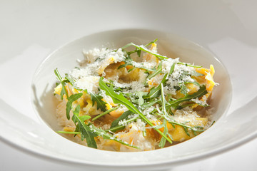 Tortellini with 4 Cheeses on White Restaurant Plate Isolated