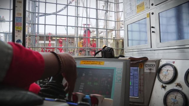 Drilling operator inside the control room operating machine