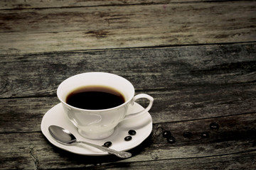 cup of coffee on wooden table