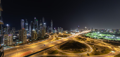 Cityscape and skyline at night in Dubai Marina.