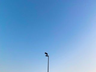 street lamp on background of blue sky 