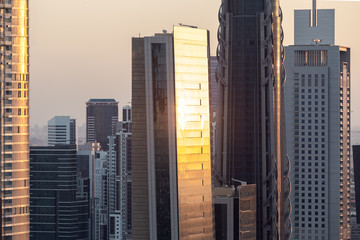 Skyscrapers and cityscape at sunset in Dubai UAE.