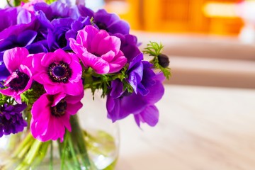 Bouquet of pink and purple flowers in glass vase