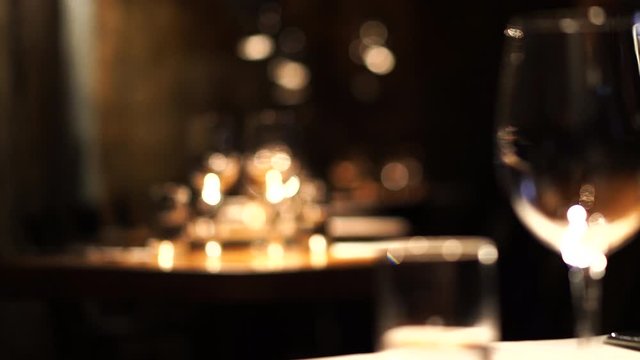 luxury dinning table setting in light atmosphere wine glasses