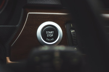 Starting the car engine using a special start / stop button built into the wood panel.