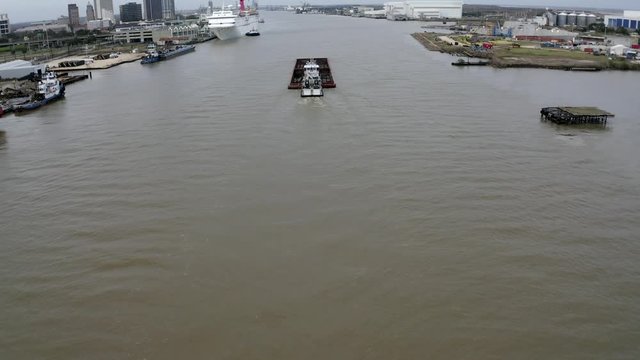 Mobile Alabama reveal as a barge and push boat cruises into the Port of Mobile