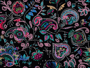 Decorative seamless floral pattern for fabric, tapestry, wallpaper and backgrounds in the style of a traditional oriental paisley pattern.