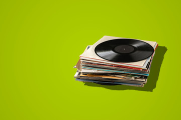 a stack of old vinyl discs, abstract retro music collection from the 80s, disco jazz blues sounds