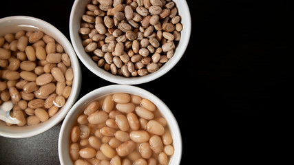 Dried, soaking in water and cooked Pinto beans.