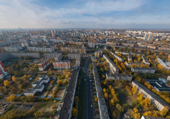 Fototapeta na wymiar Aerial view of Ekaterinburg city. District of the city - Elmash. Autumn, sunny. Yellow leaves on trees