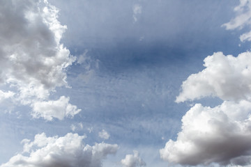 Blue sky and large clouds that are overcast
