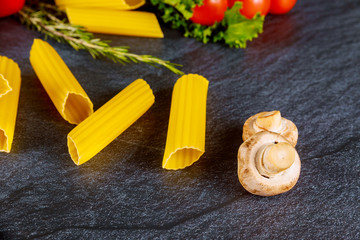 Organic pasta manicotti with mushrooms and cherry tomato.