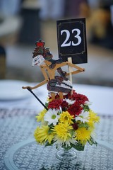 Magelang, Indonesia, 18 Sept 2018. A bundle of flowers and miniature wooden puppets as ornaments as...