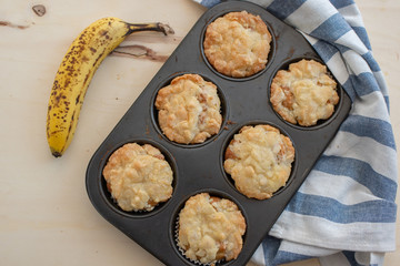 Homemade banana muffins on the wooden table