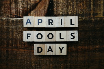 April Fools Day alphabet letter on wooden background