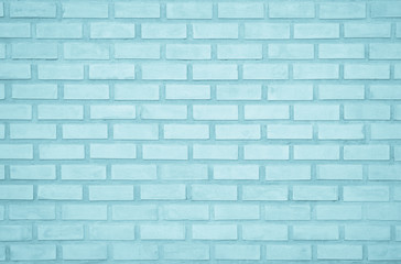 Obraz premium Pastel Blue and White brick wall texture background. Brickwork painted of blue color interior rock old pattern clean concrete grid uneven brick design stack. Home or office design backdrop decoration.
