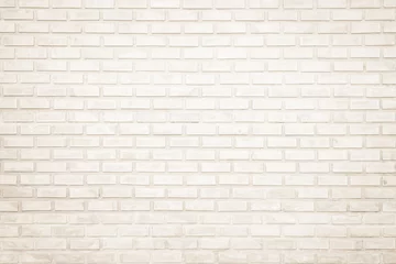 Crédence de cuisine en verre imprimé Mur de briques Background of wide cream brick wall texture. Old brown brick wall concrete or stone wall textured, wallpaper limestone abstract flooring/Grid uneven interior rock. Home or office design backdrop.