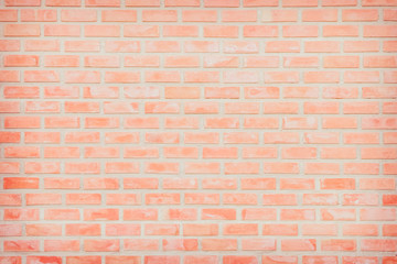Background of wide old red brick wall texture. Old Orange brick wall concrete or stone wall textured, wallpaper limestone abstract flooring/Grid uneven interior rock. Home or office design backdrop.