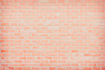 Background of wide old red brick wall texture. Old Orange brick wall concrete or stone wall textured, wallpaper limestone abstract flooring/Grid uneven interior rock. Home or office design backdrop.