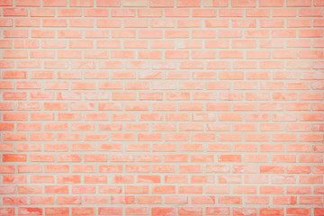 Fototapeta premium Background of wide old red brick wall texture. Old Orange brick wall concrete or stone wall textured, wallpaper limestone abstract flooring/Grid uneven interior rock. Home or office design backdrop.