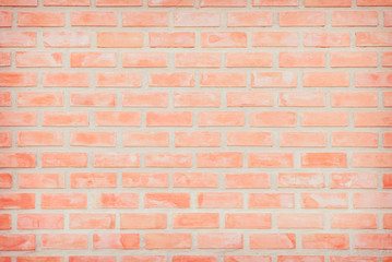 Background of wide old red brick wall texture. Old Orange brick wall concrete or stone wall textured, wallpaper limestone abstract flooring/Grid uneven interior rock. Home or office design backdrop.