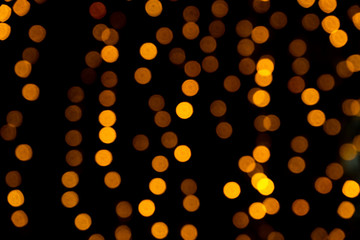 Gold blur bokeh background on a black background