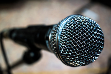 black microphone with silver mesh